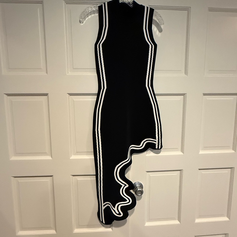 Sleeveless Black Dress with White Trim and Asymmetric Ruffle